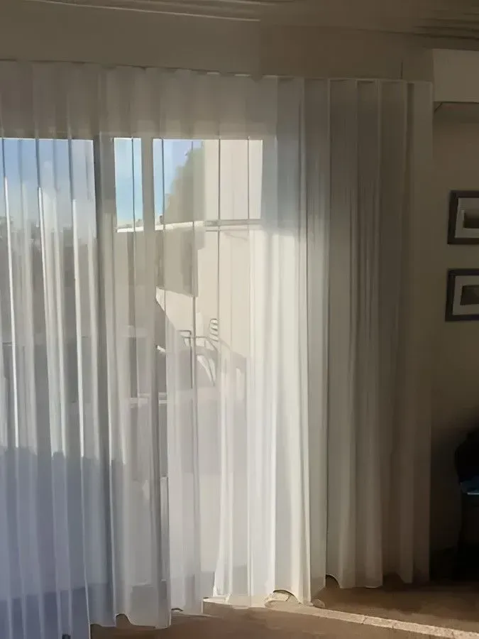 Sheer White Curtains Beside a Sunlit Sliding Glass Door in a Room — Another Blind Man in Tewantin, QLD