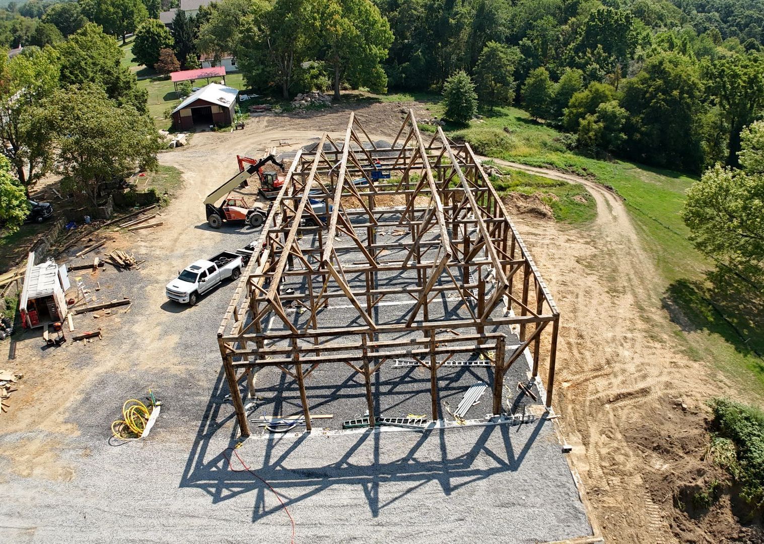 An aerial view of a reclaimed barn being reconstructed 