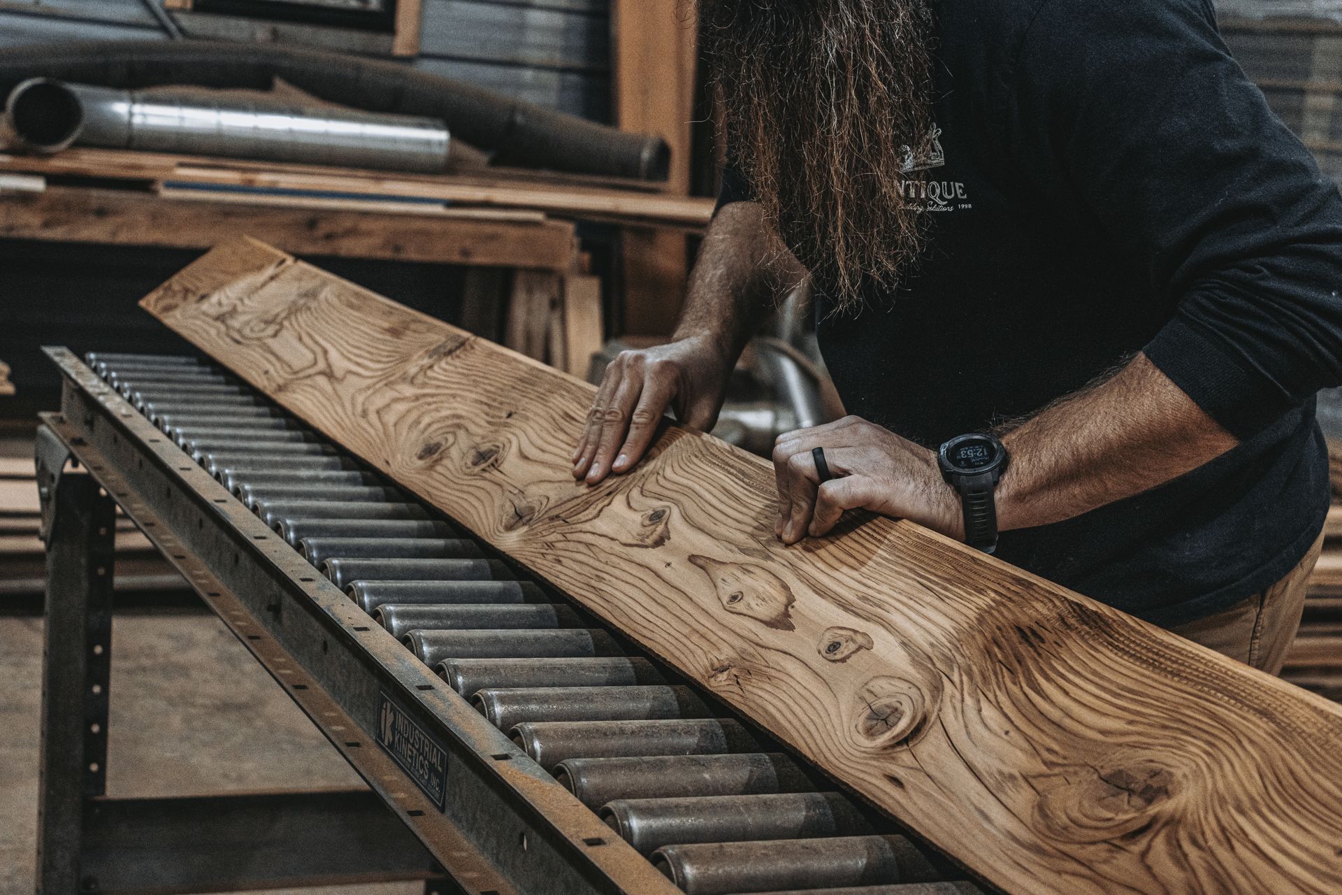 A piece of reclaimed, finished lumber is being processed in Central Pennsylavania.