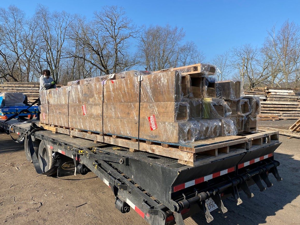 Flatbed truck transportation of reclaimed barn wood from Central Pennsylvania antique barn. 