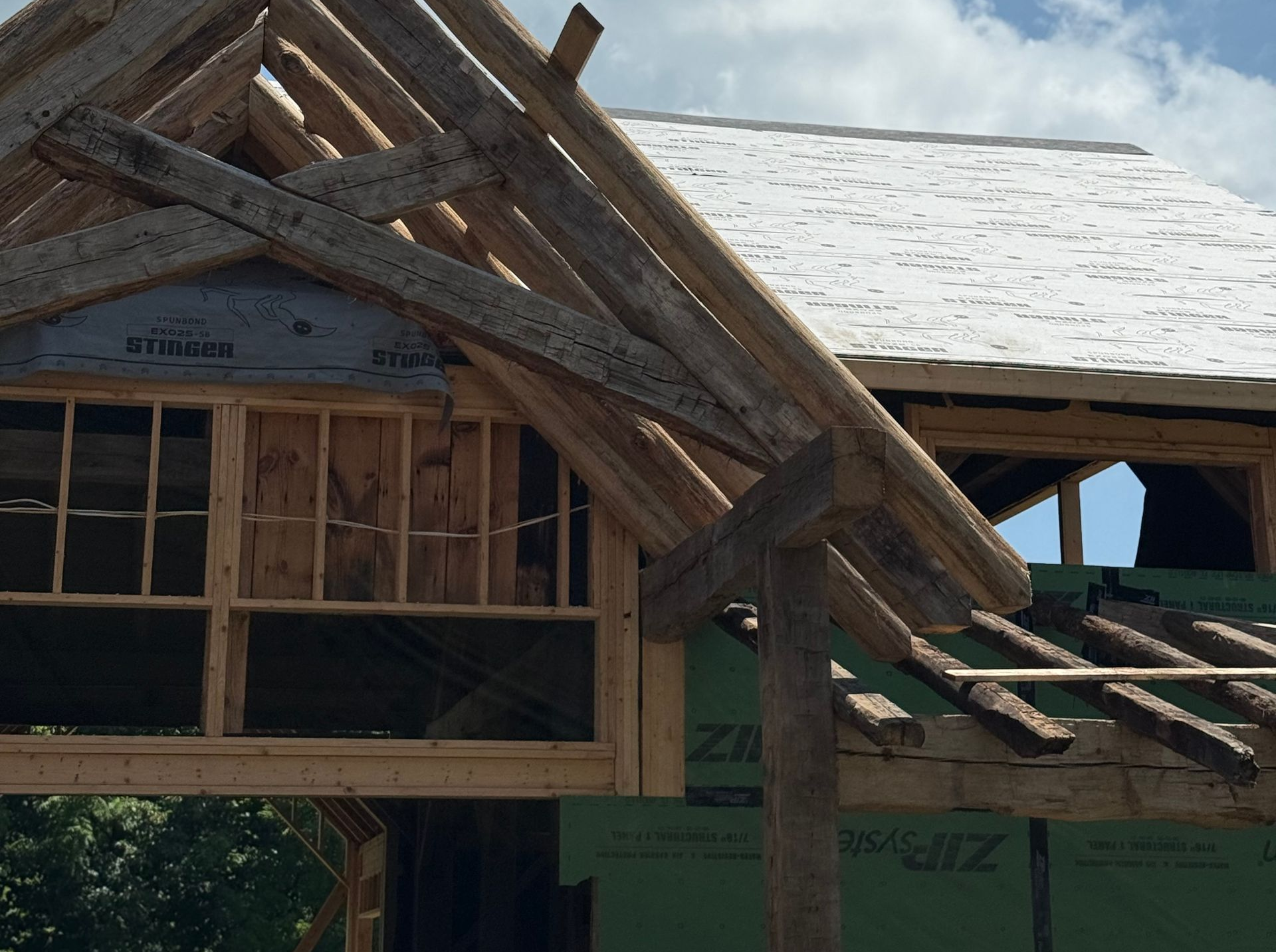 Building under construction with exposed window framing.