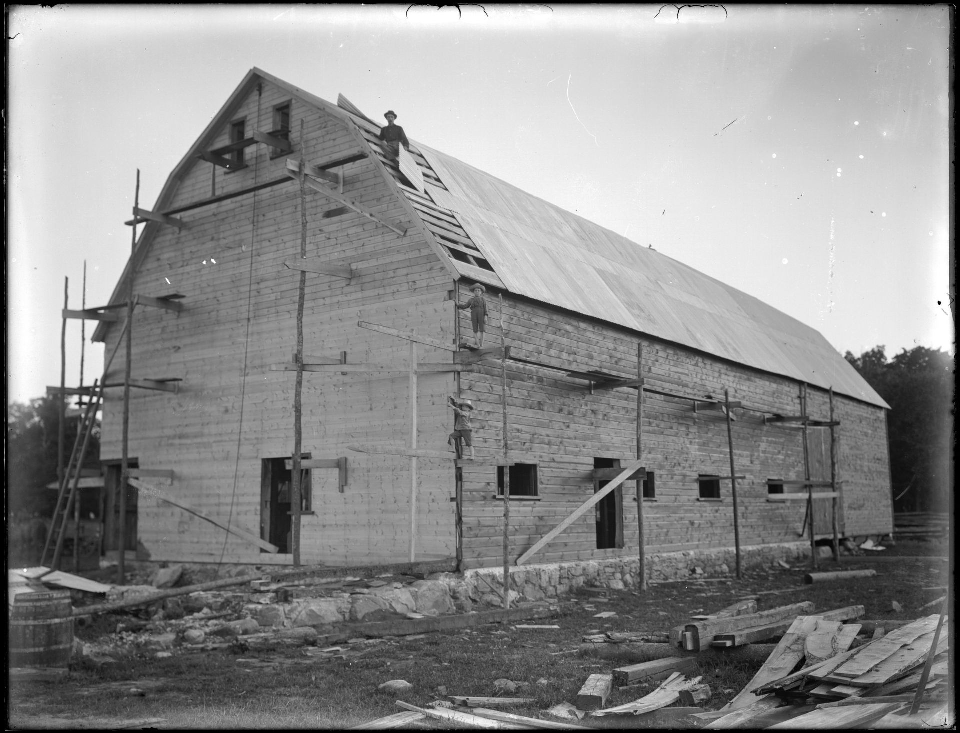 Barn under construction showcasing heritage-inspired architecture.