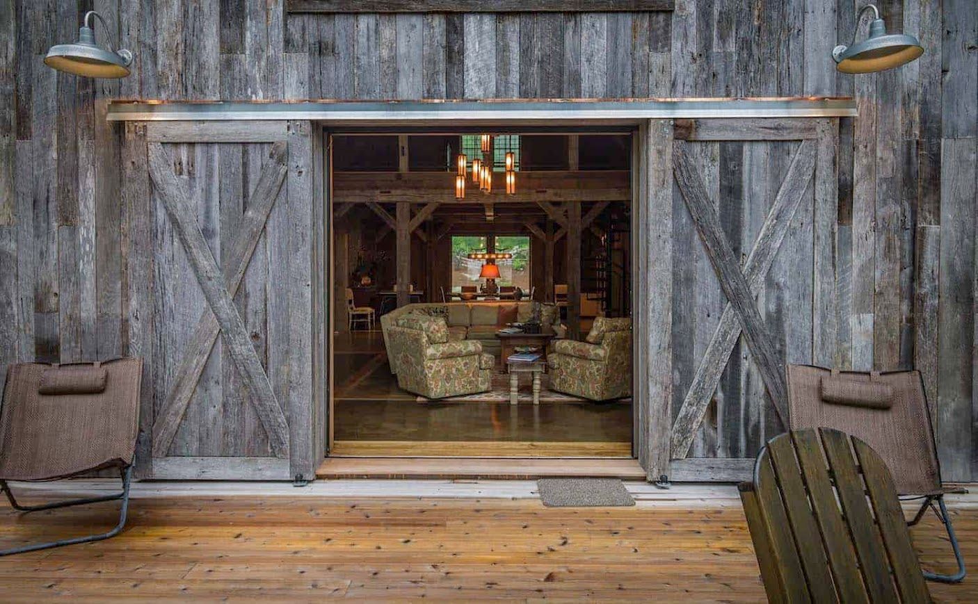 Rustic sliding door opening to historic barn homes.