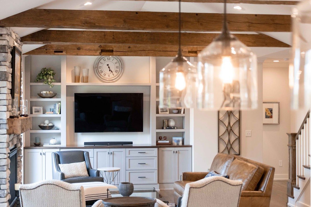 Living Room with Exposed Wooden Beams and Built-In Shelves in Pennsylvania