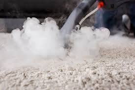 Steam cleaning, emitting white steam from a commercial steam cleaning machine