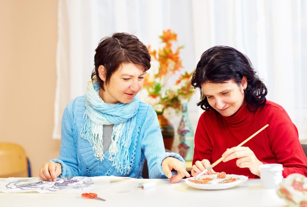 Adult Woman With Special Needs Are Engaged In Handcraft In Rehabilitation Center — Comfort N Care Support QLD Pty Ltd In Toowoomba City, QLD