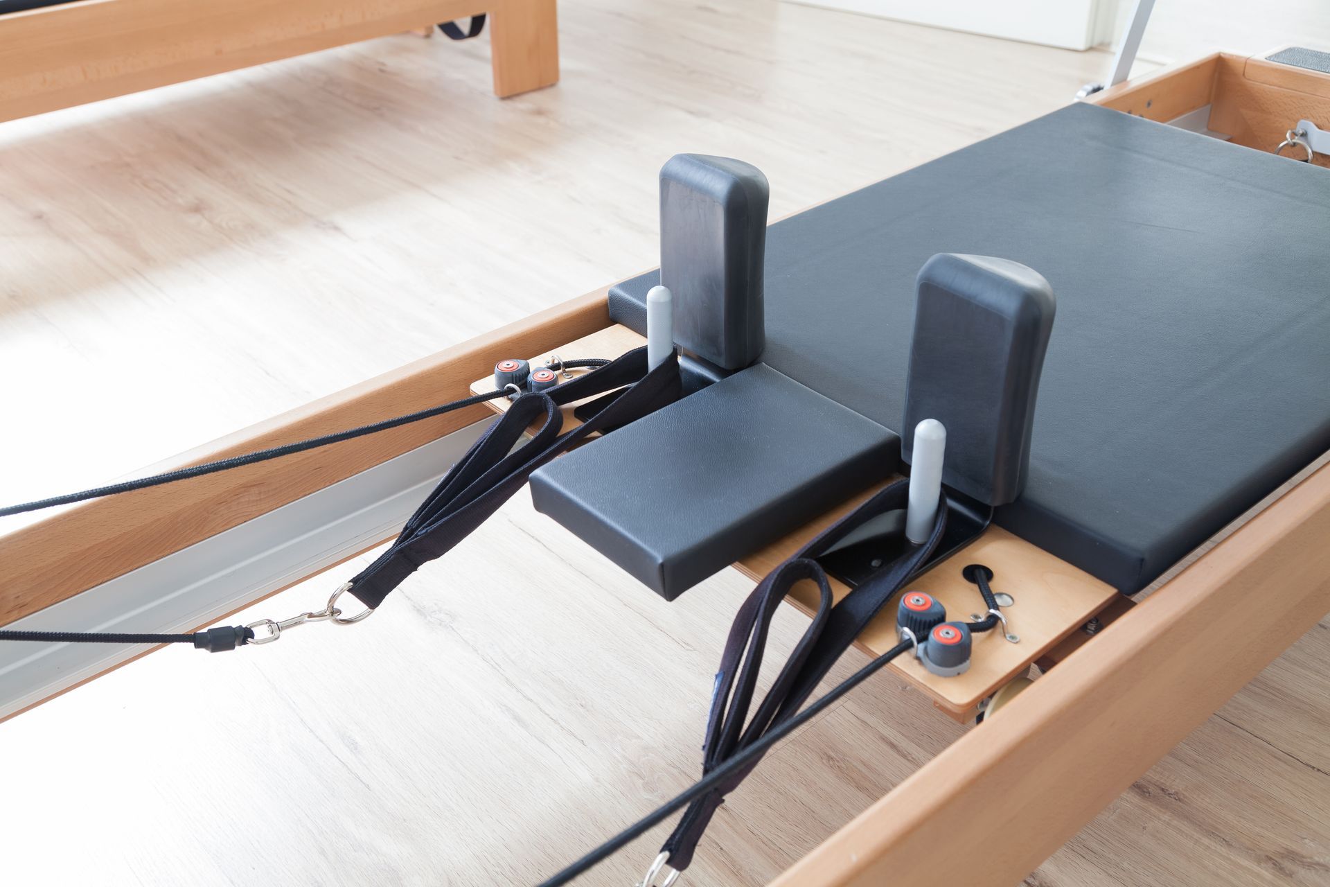 Reformer pilates studio machine for fitness workouts in gym
