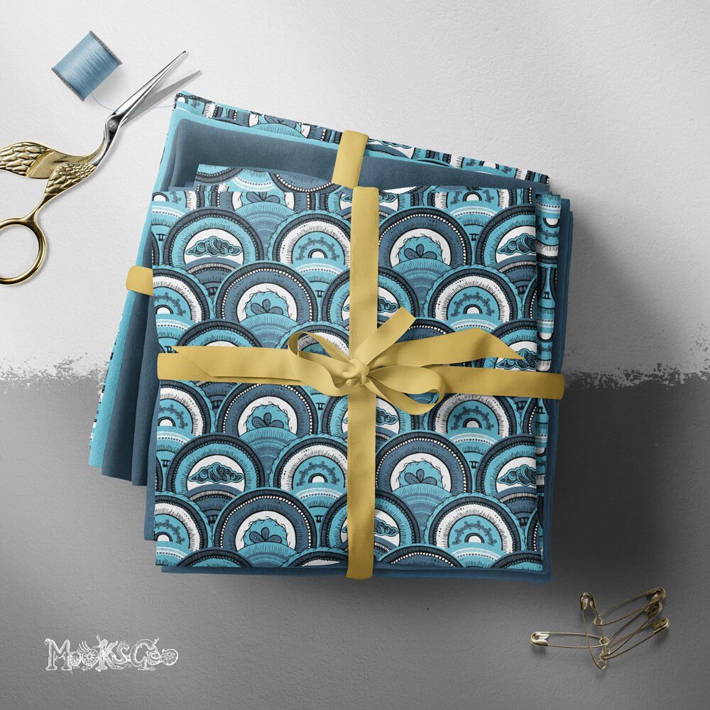 Overlapping circles or shells repeat pattern on fabric with clouds and flowers, using different blue tones. Illustration by MooksGoo
