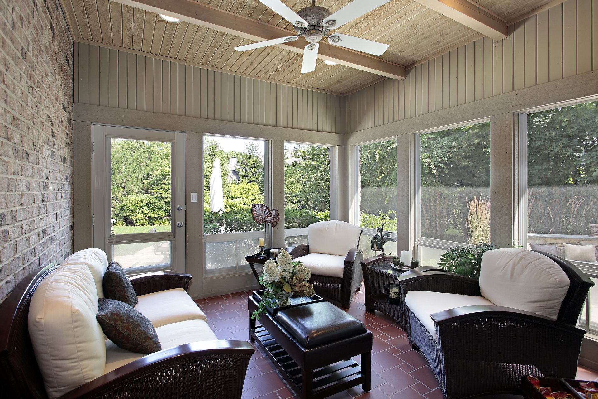 A living room with furniture and a ceiling fan