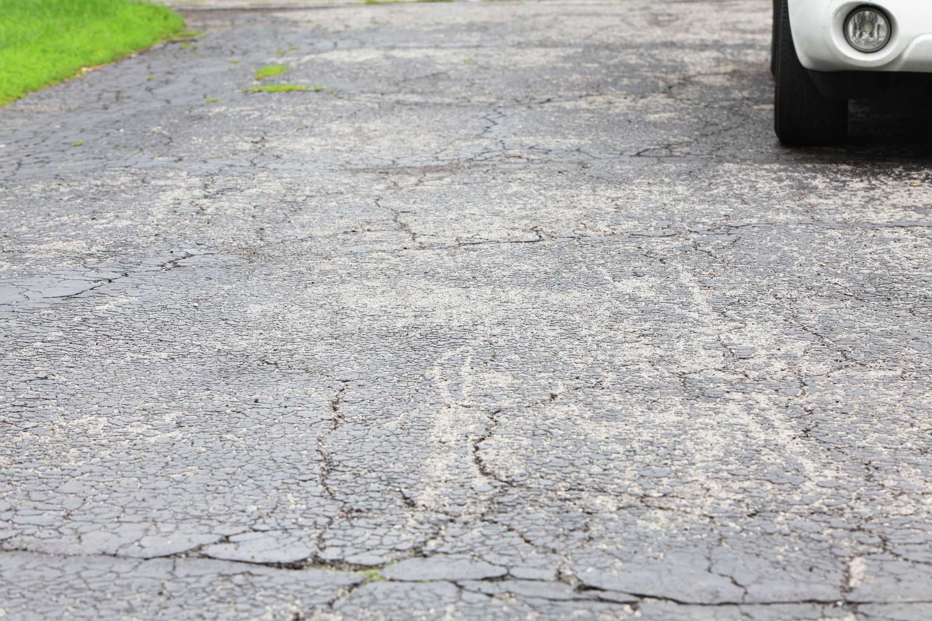 Driveway With Extensive Cracks - Lee’s Summit, MO - Heartland Fence & Concrete Co.