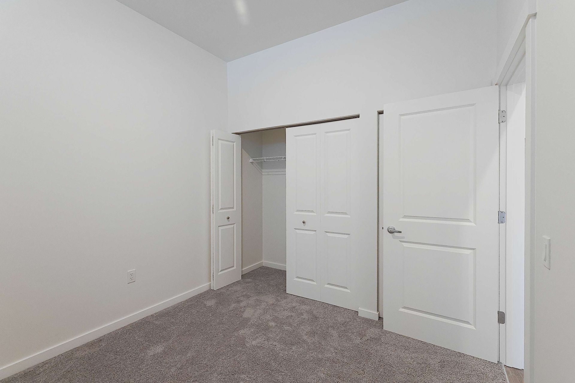 There is a closet in the corner of the room.