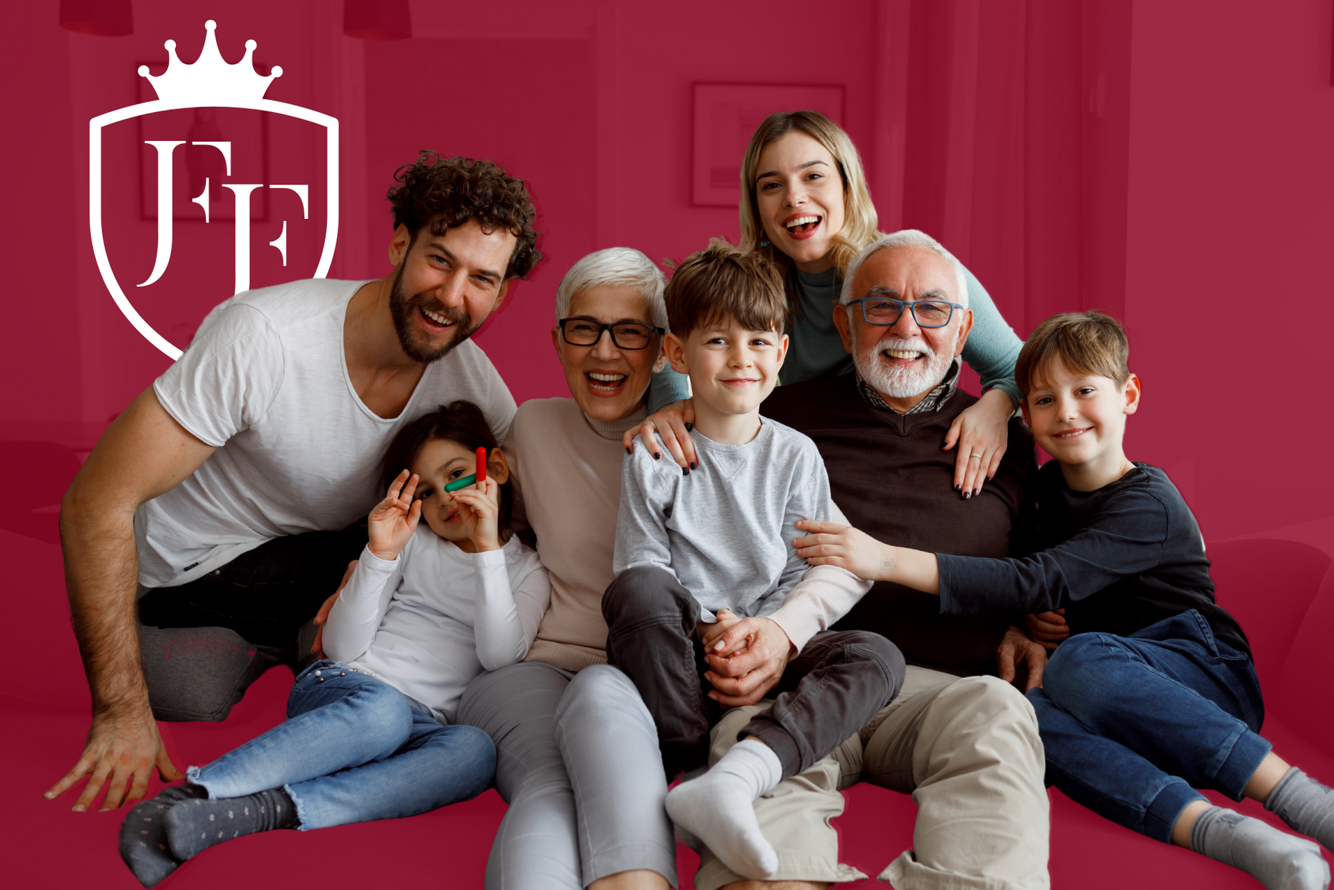 Family of seven smiling on a red couch; logo in the upper left corner.