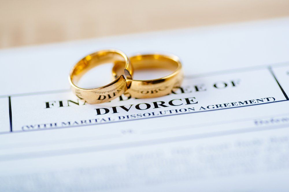 Marrage Ring On Top Of A Divorce Paper — Lawyers in Dubbo, NSW