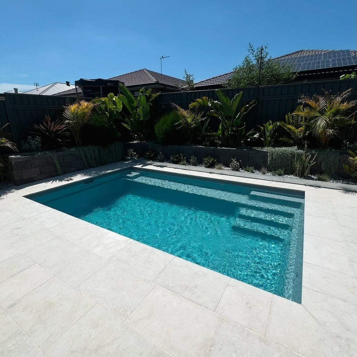 A Large Swimming Pool with Stairs — Billabong Pool Co in Shellharbour, NSW