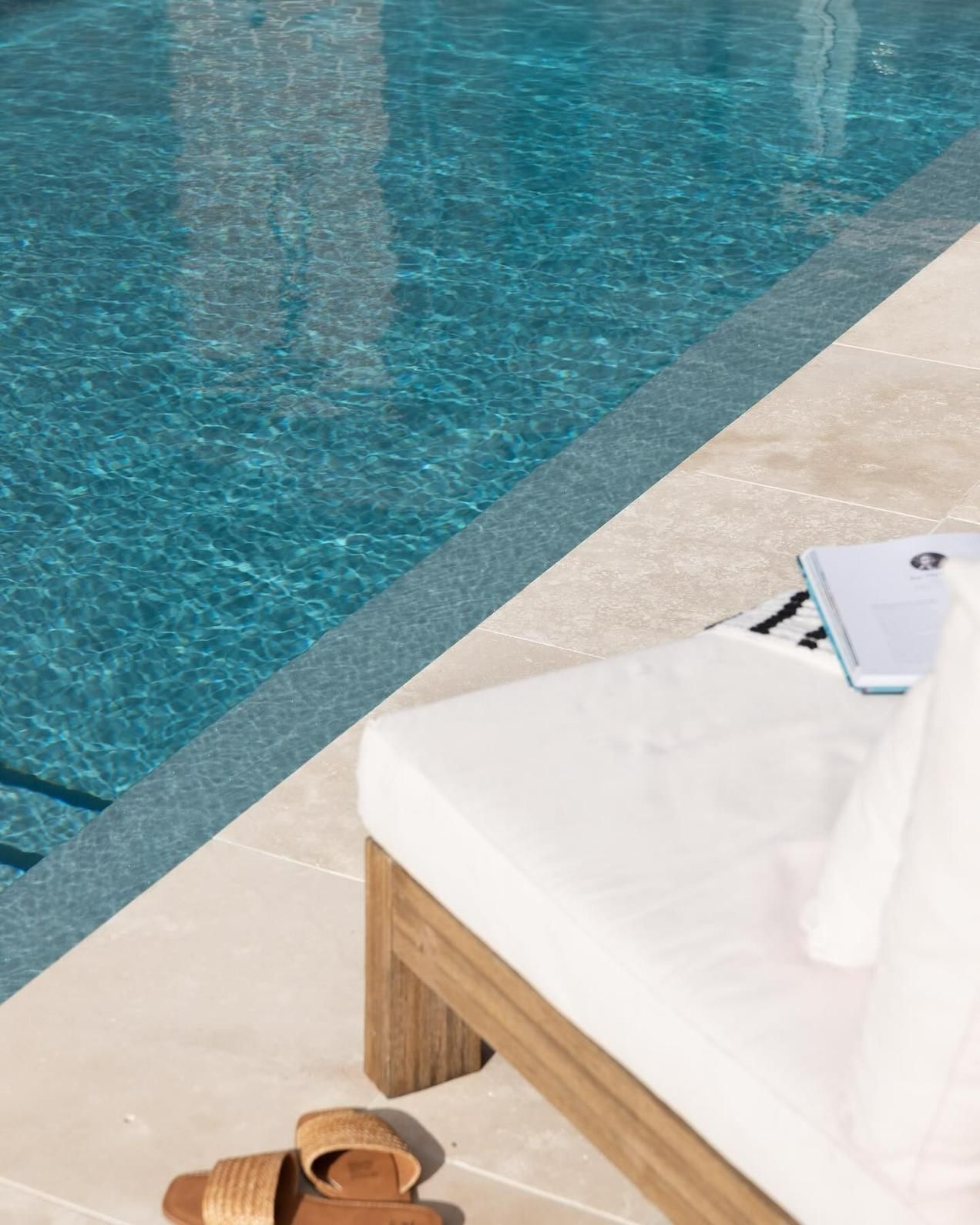 A Pair of Sandals Are Sitting on A Chair — Billabong Pool Co in Smeaton Grange, NSW