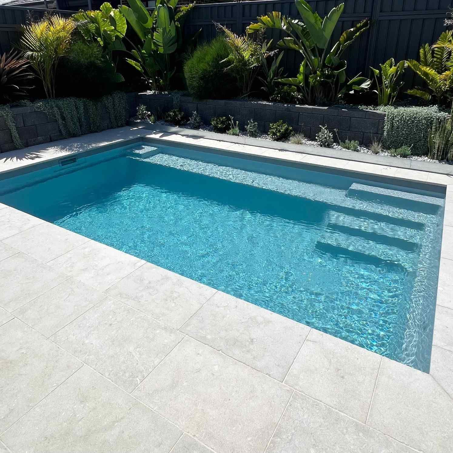 Rectangular Backyard Swimming Pool With Blue Water — Billabong Pool Co in Smeaton Grange, NSW