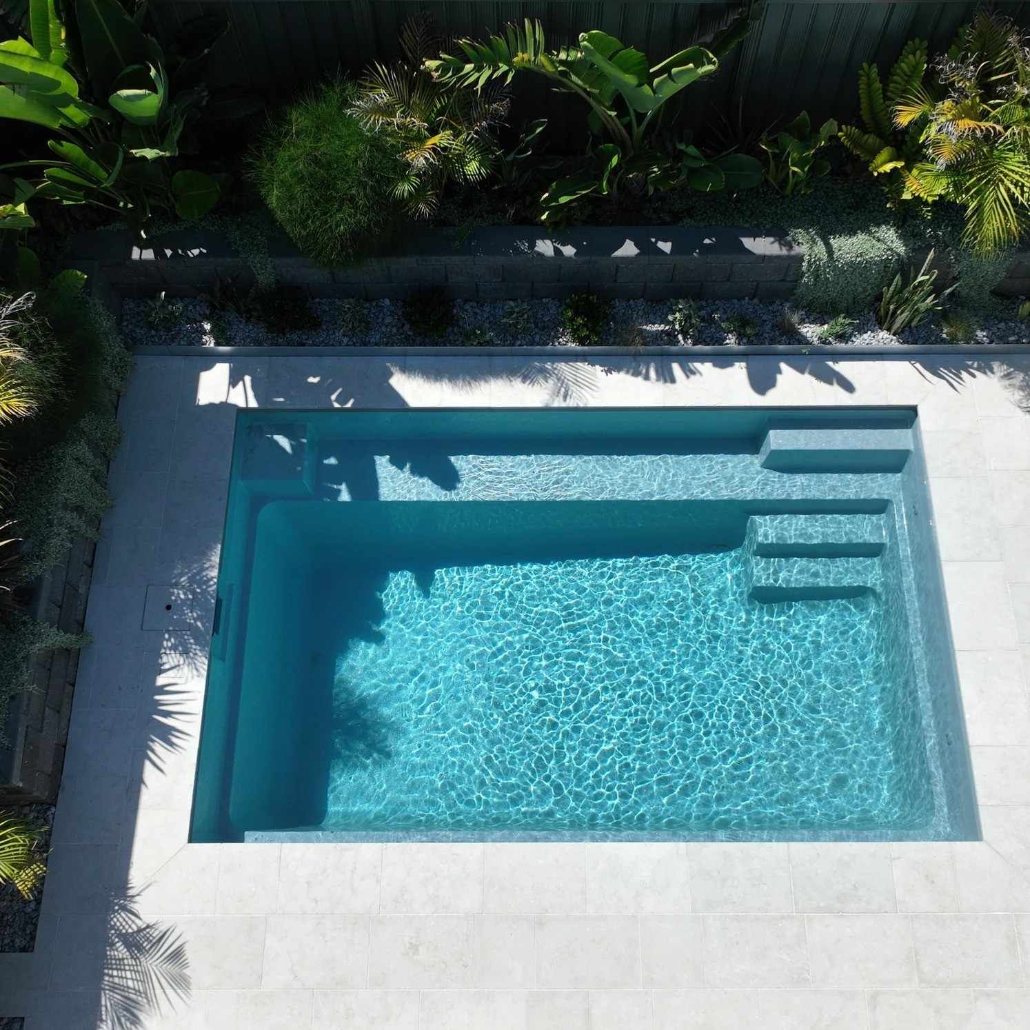 Top-down View of a Turquoise Backyard Pool With Steps — Billabong Pool Co in Smeaton Grange, NSW