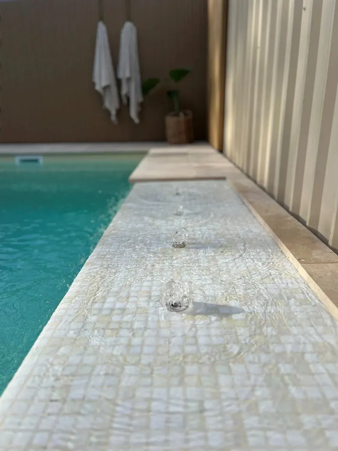 Poolside Ledge Beside Turquoise Water — Billabong Pool Co in Smeaton Grange, NSW