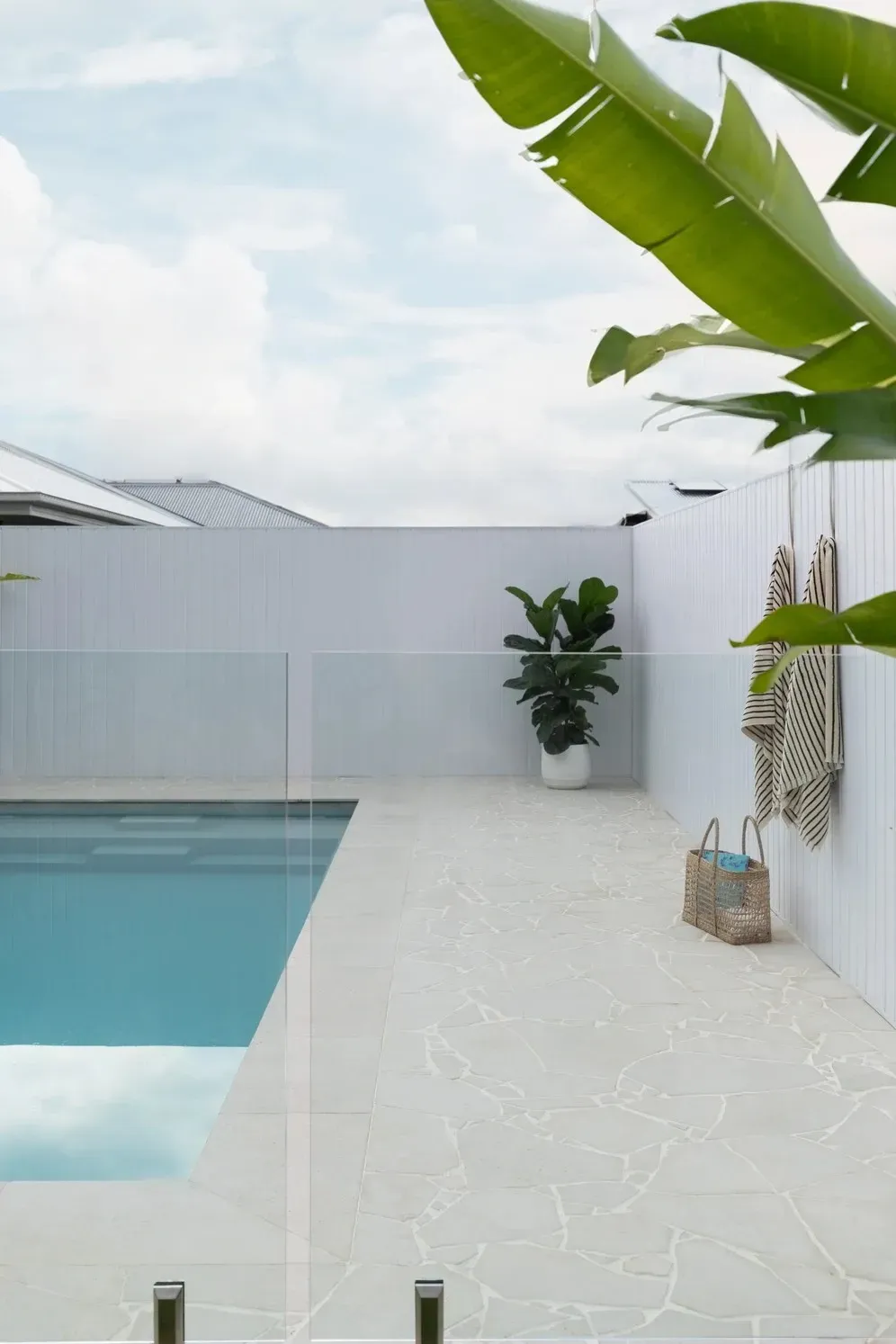 Bright Patio Beside a Turquoise Pool, With White Walls — Billabong Pool Co in Smeaton Grange, NSW