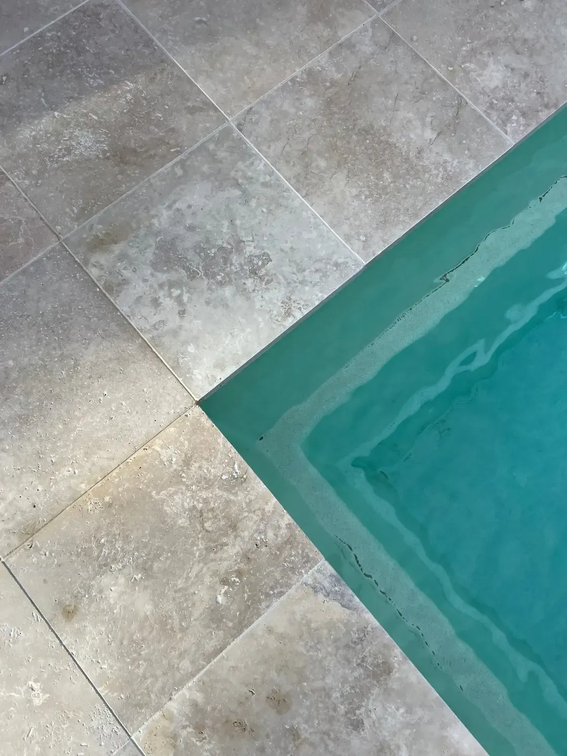 Gray Stone Pool Deck Beside Turquoise Water — Billabong Pool Co in Smeaton Grange, NSW