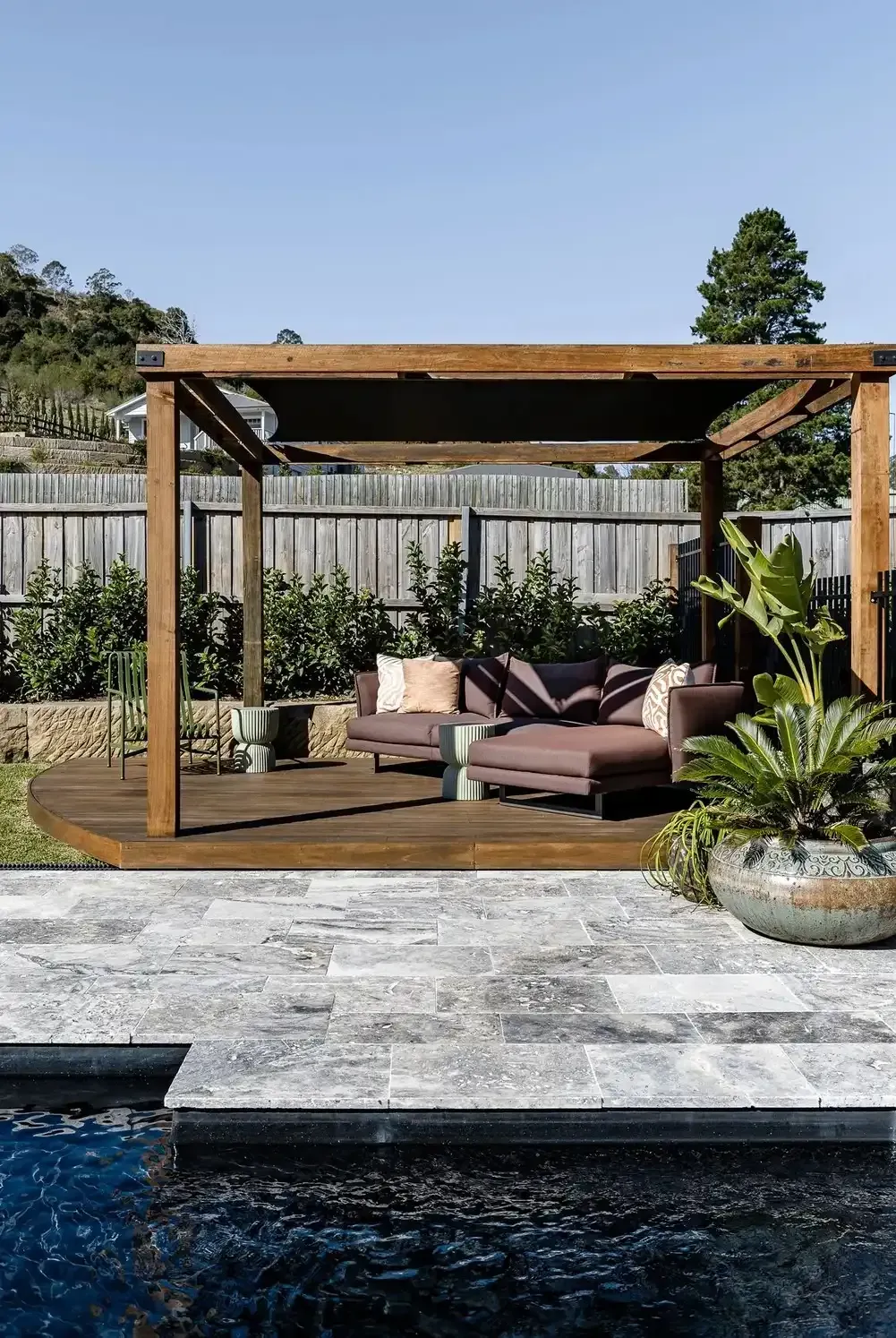 Wooden Poolside Cabana With Beige Seating — Billabong Pool Co in Smeaton Grange, NSW