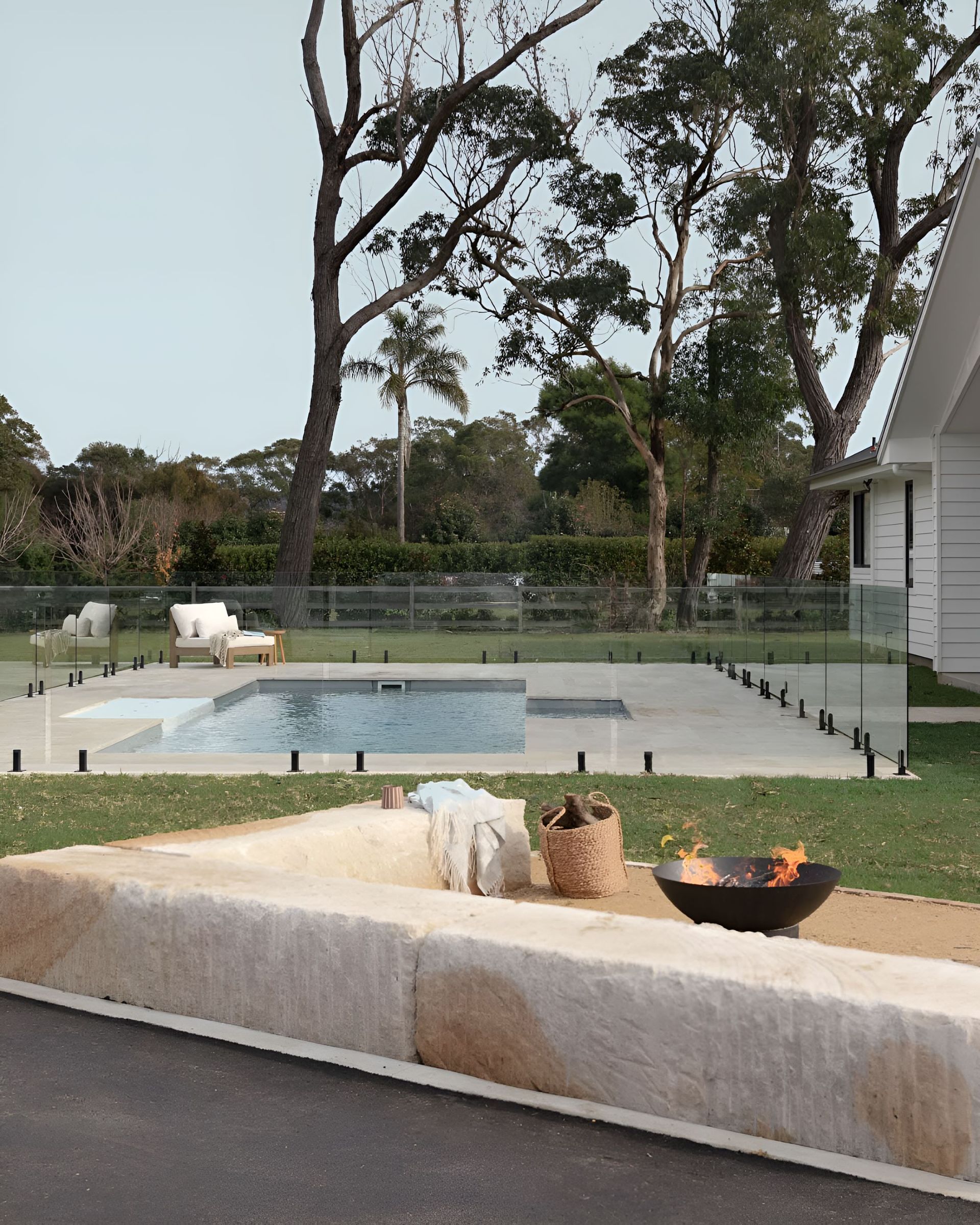 A Large Swimming Pool in The Backyard of A House — Billabong Pool Co in Camden, NSW