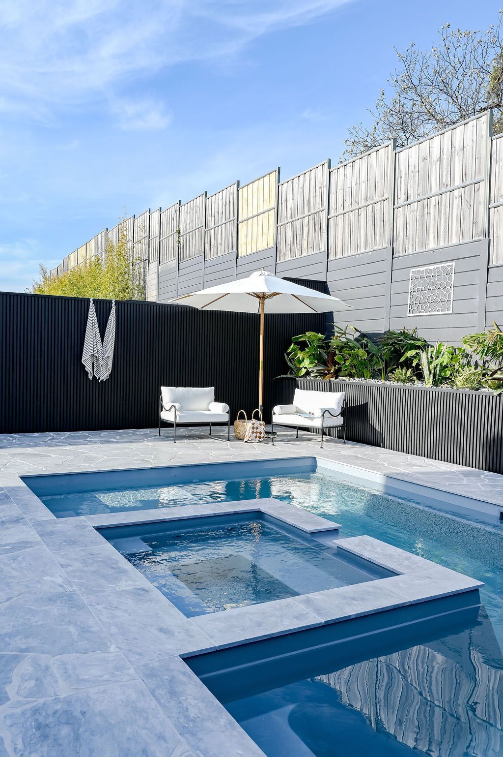 Modern Backyard Pool With Blue Water, White Lounge Chairs — Billabong Pool Co in Smeaton Grange, NSW