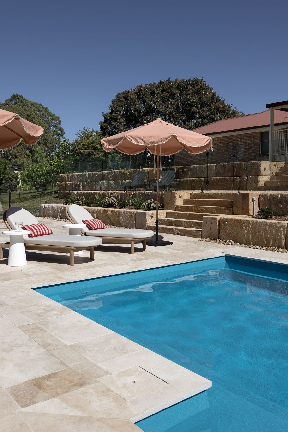 Luxury Backyard With Blue Pool, Lounge Chairs — Billabong Pool Co in Smeaton Grange, NSW