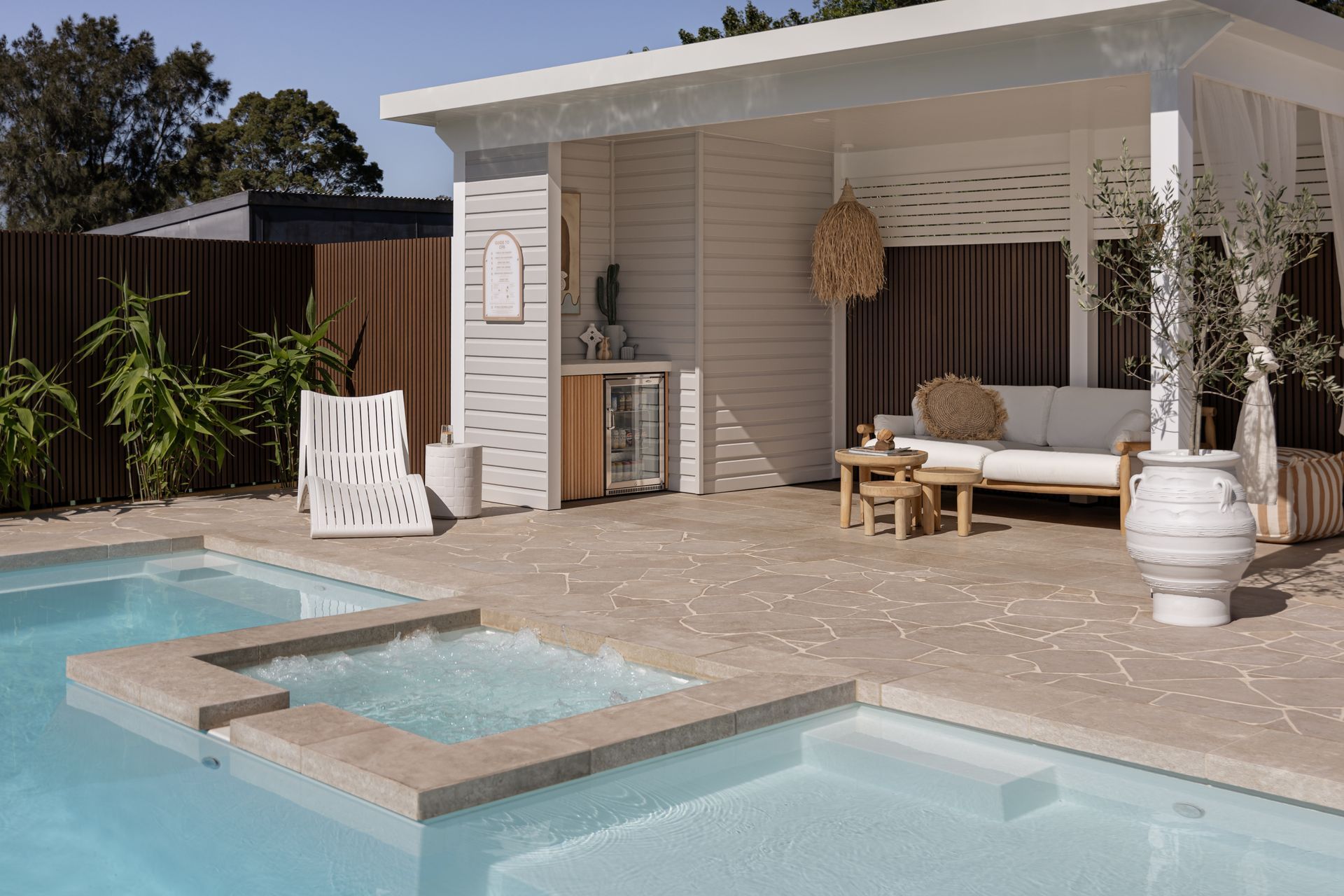 Modern Poolside Patio With Outdoor Seating — Billabong Pool Co in Smeaton Grange, NSW