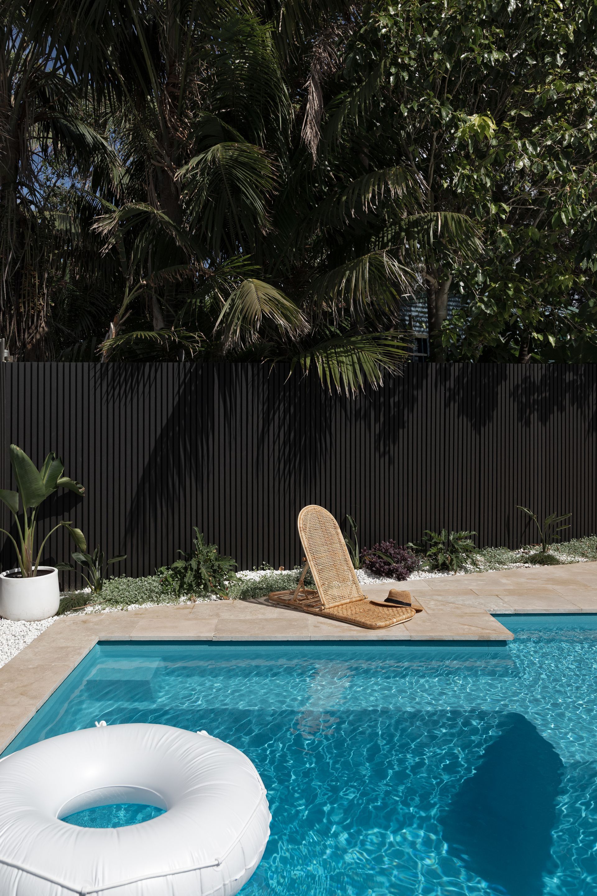 Backyard Pool With a White Float, Tan Lounge Chair — Billabong Pool Co in Smeaton Grange, NSW