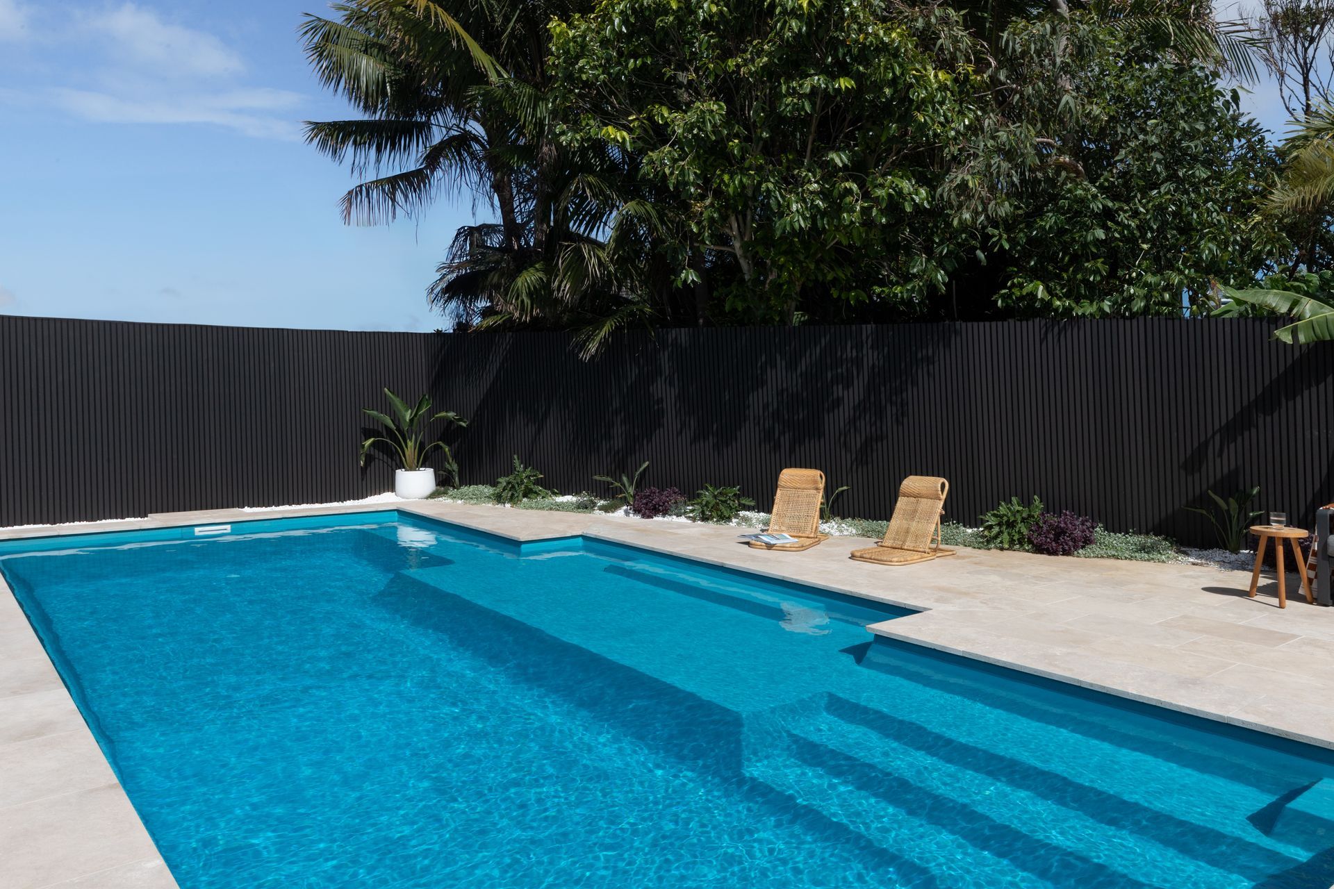 Backyard Swimming Pool With Blue Water — Billabong Pool Co in Smeaton Grange, NSW