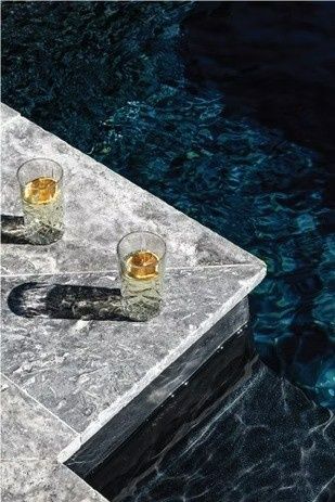 Two Glasses of Whiskey Are Sitting on A Table — Billabong Pool Co in Wollondilly, NSW