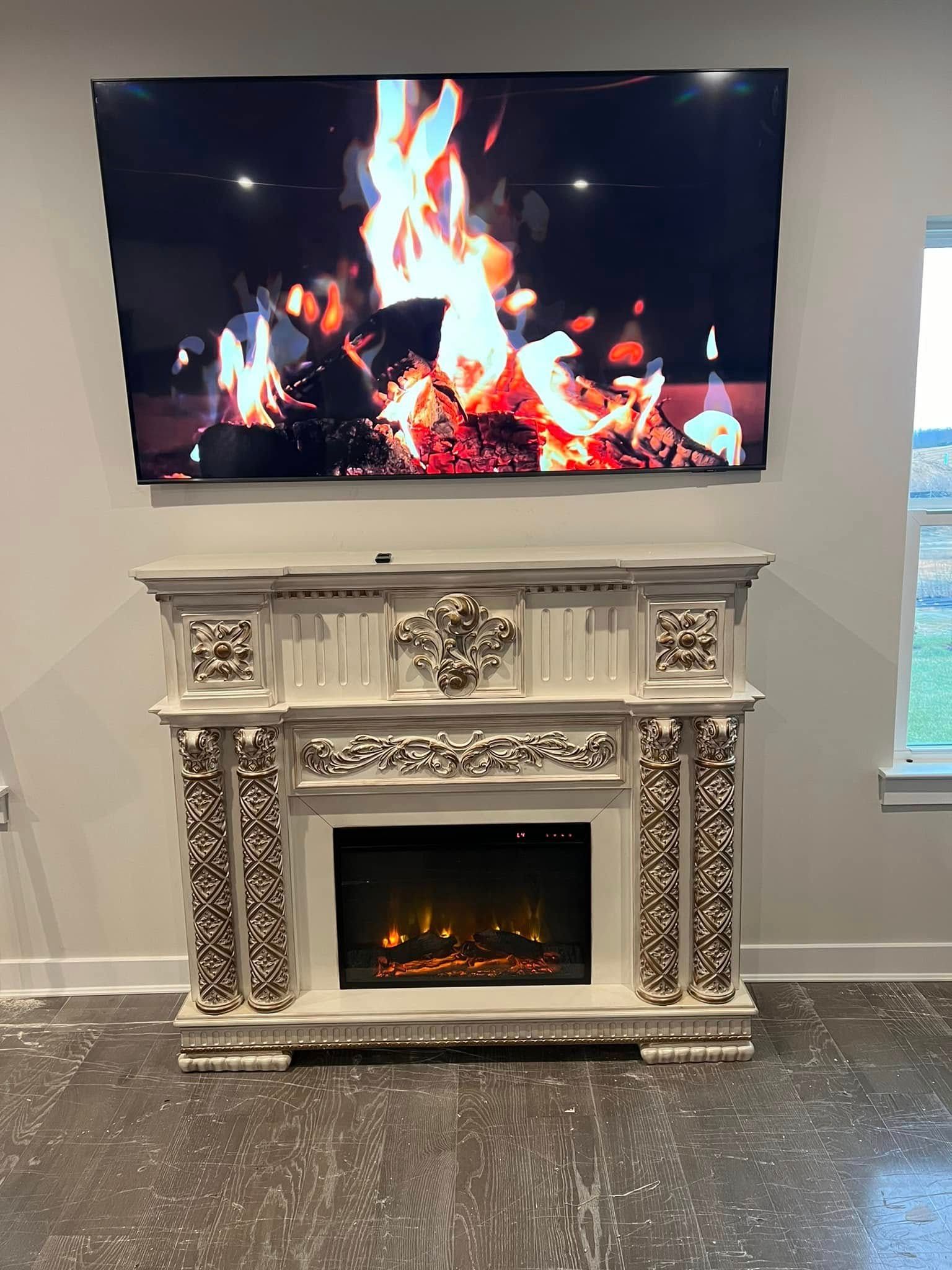 Ornate white fireplace beneath a wall-mounted TV showing a crackling fire in a modern room