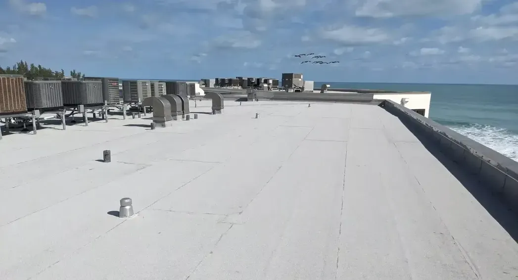 Commercial roof replacement with PVC roofing, insulation, metal fabrication, and shingle roof areas in Jupiter, Florida