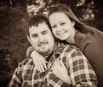 A Couple Smiling Together. Shop Wedding Registries at McAdams' Ltd., a Gift Store in Columbia, MO.