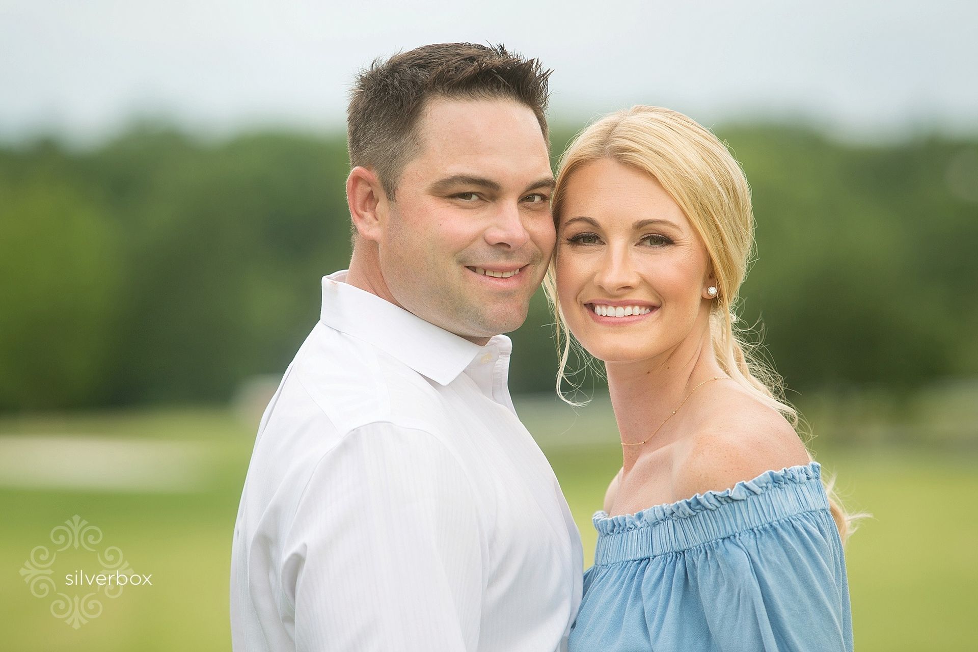 A Couple Smiling Together. Shop Wedding Registries at McAdams' Ltd., a Gift Store in Columbia, MO.