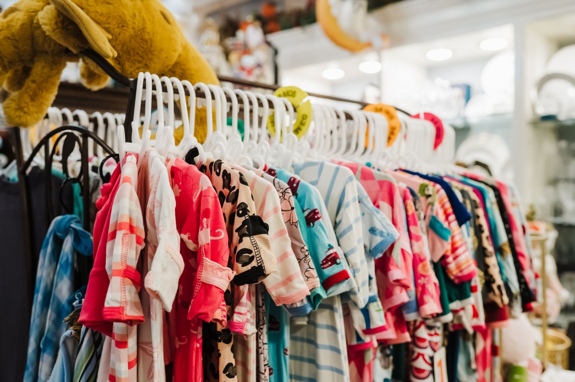 A Rack of Children’s Clothing. Register for Your Baby Shower at McAdams in Columbia, Missouri.