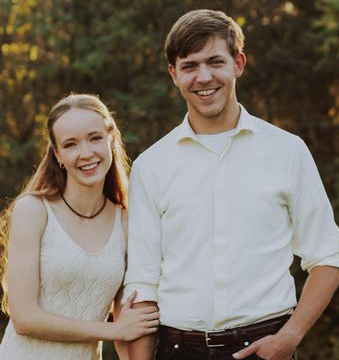A Couple Smiling Together. Shop Wedding Registries at McAdams' Ltd., a Gift Store in Columbia, MO.
