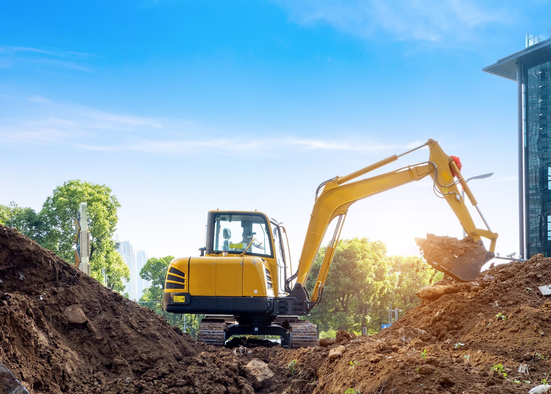 Excavators excavate earth at the construction site