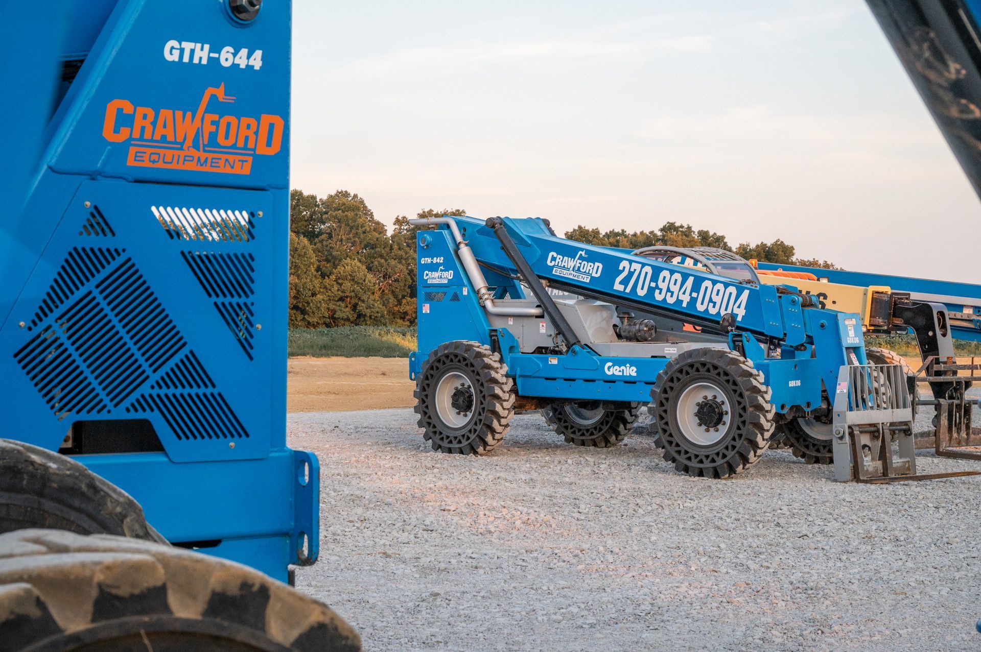 Blue Genie telehandler on gravel, with