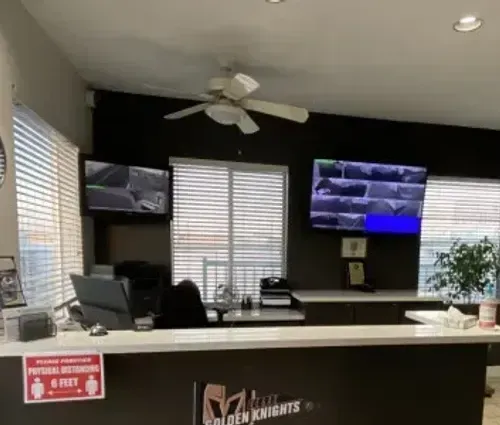 Green Valley Storage office with security camera monitors