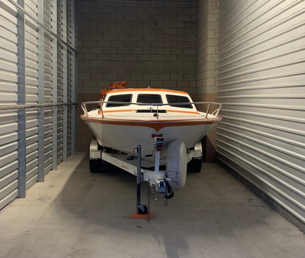 Boat on a trailer inside an enclosed drive-up garage at our Lake Mead Pkwy facility