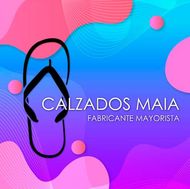 Logotipo de Calzados Maia con fondo de copo de nieve azul  en texto negro.