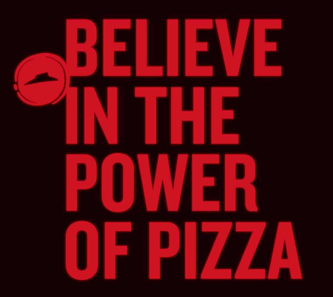 A poster that says believe in the power of pizza