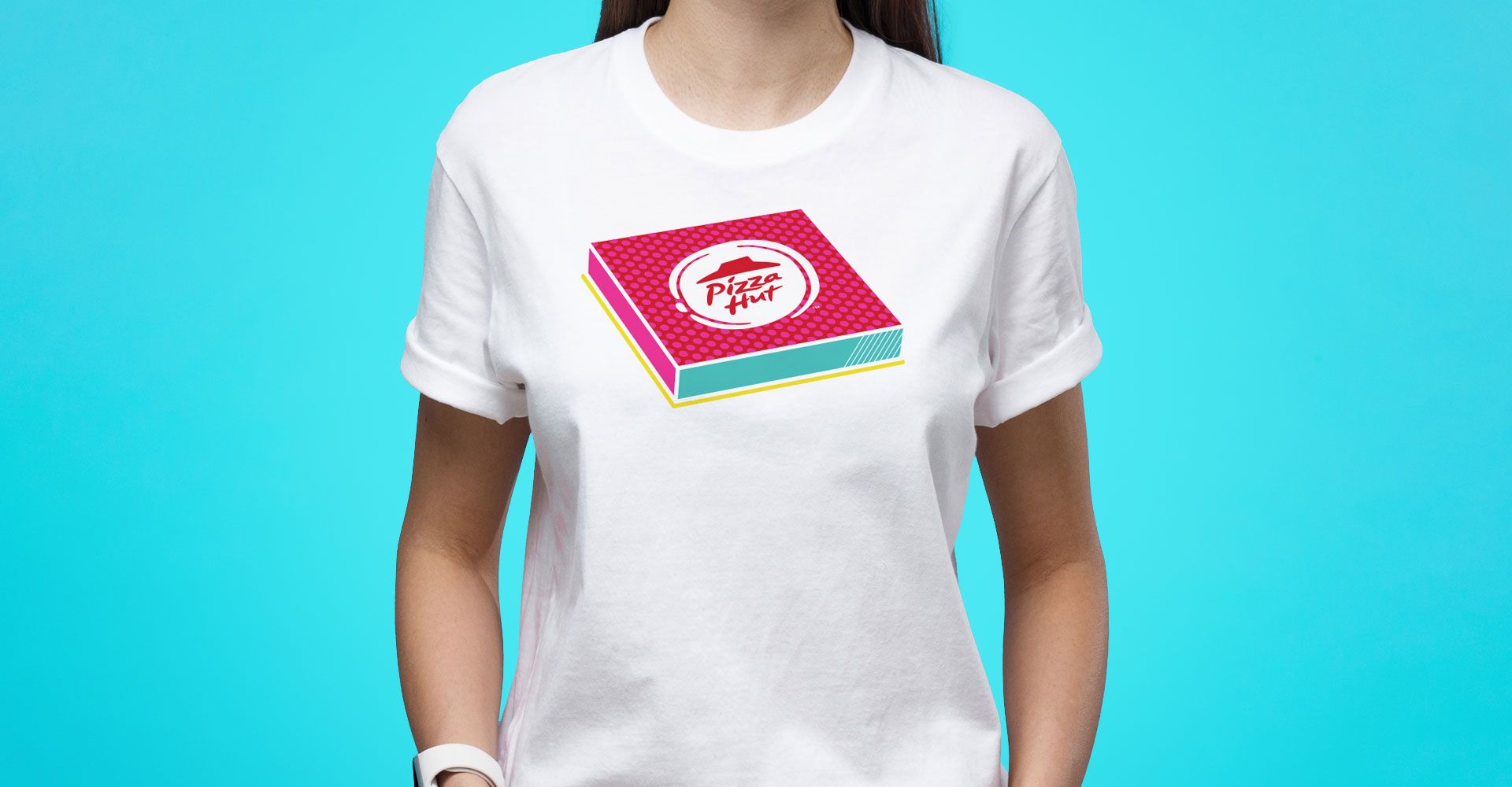 A woman is wearing a white t-shirt with a pizza box on it.