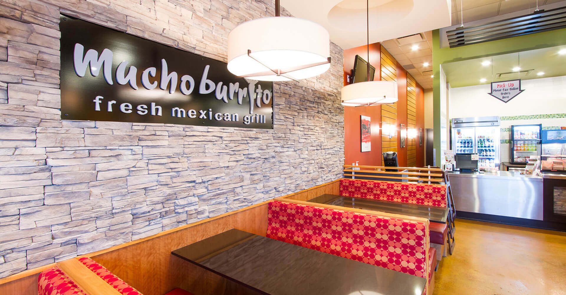 A restaurant with a sign that says mucho berry ho fresh mexican grill