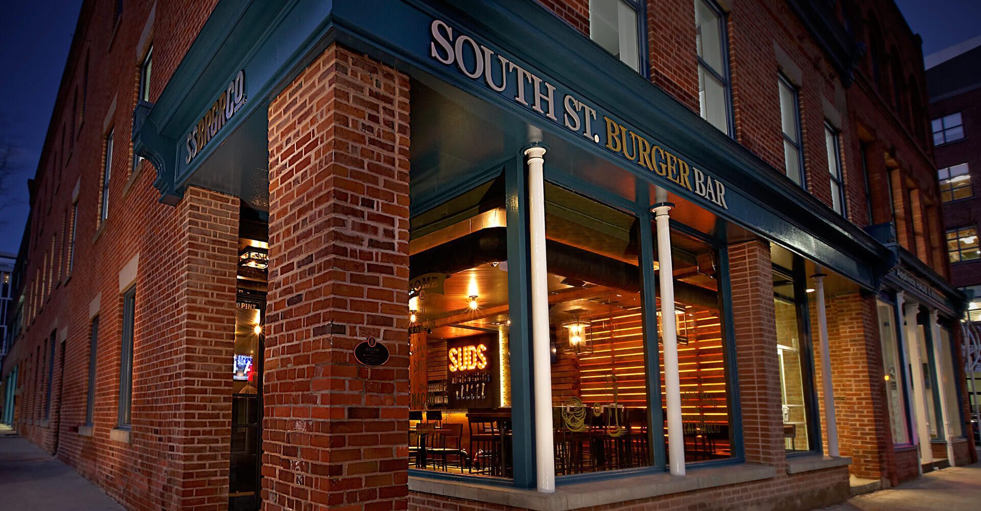 A brick building with a sign that says south st.