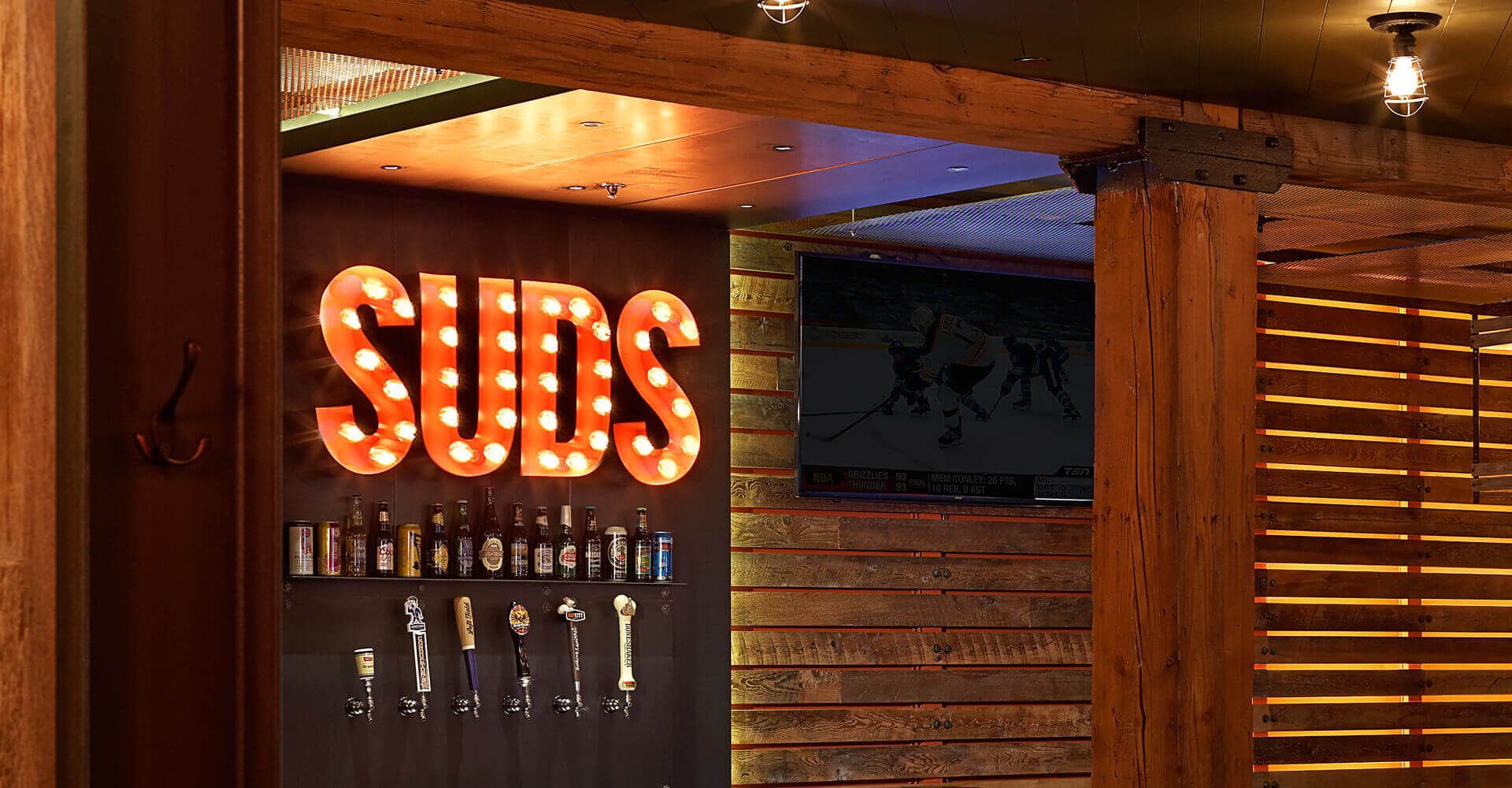 A restaurant with a sign that says ' suds ' on it