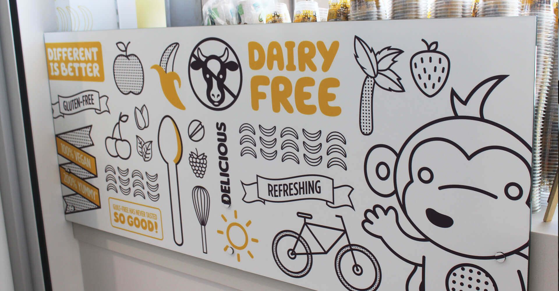 A sign that says dairy free with a monkey on it