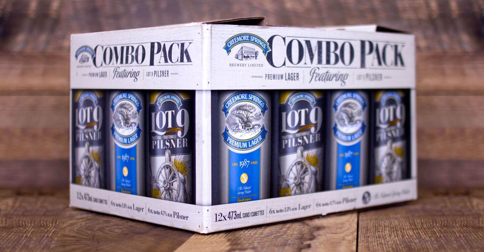 A box of corona beer is sitting on a wooden table.